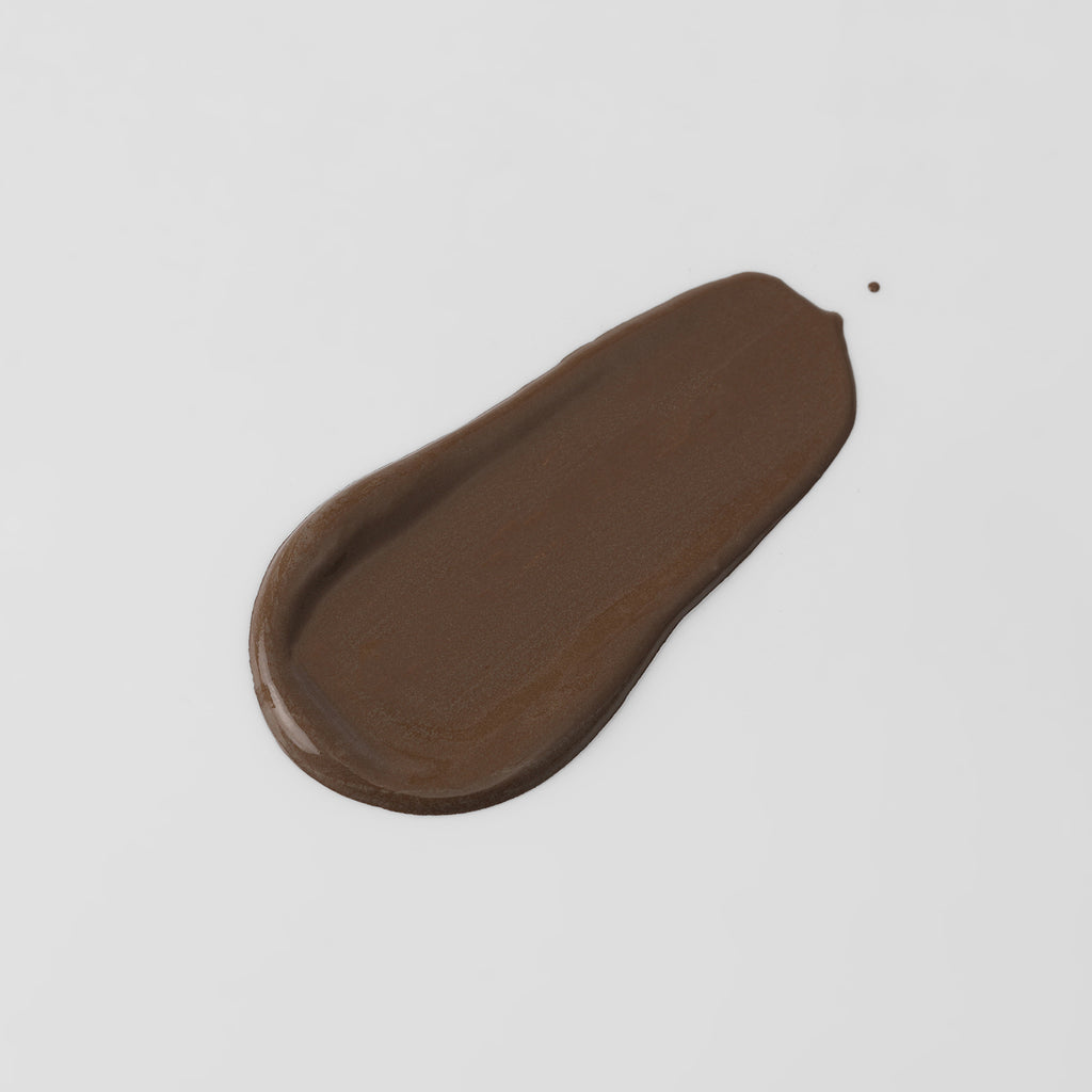 The Overachiever tinted moisturizer and foundation swatch in Espresso – vegan, buildable, skin-loving formula by Puzzle Makeup