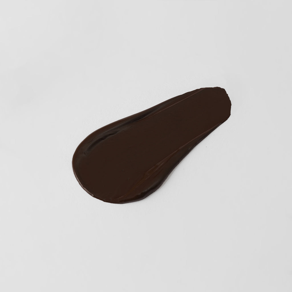 The Overachiever tinted moisturizer and foundation swatch in Obsidian – vegan, buildable, skin-loving formula by Puzzle Makeup