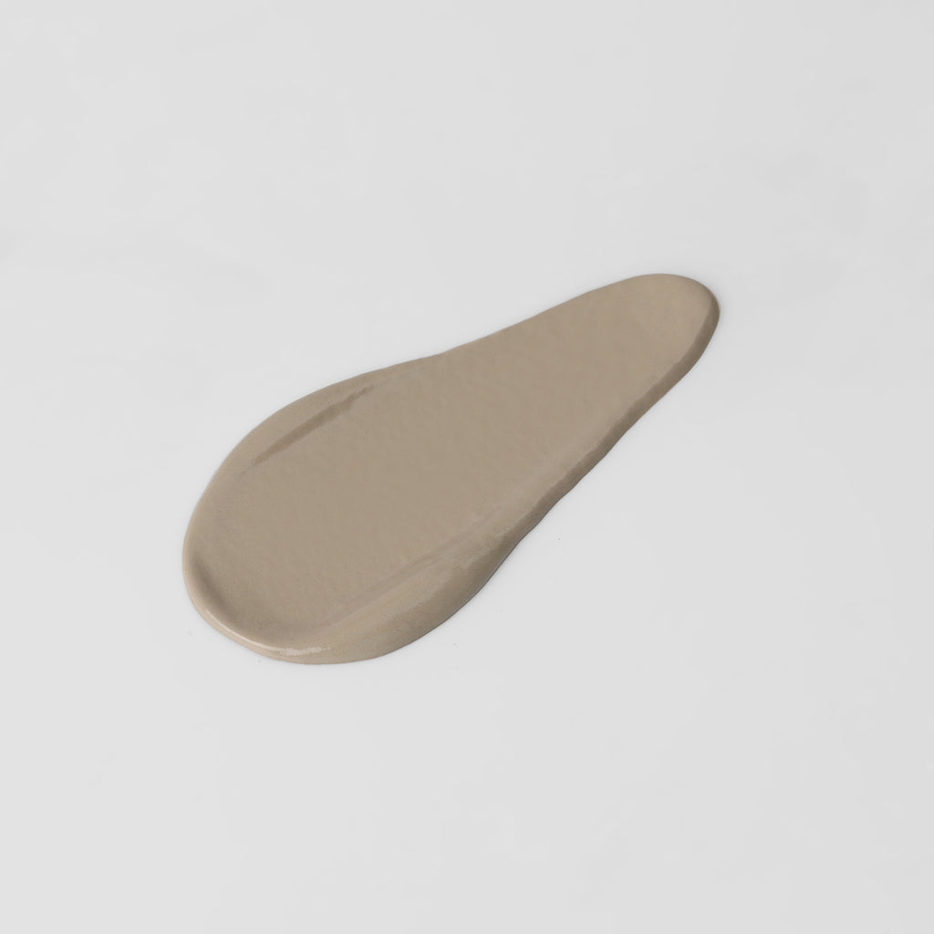 The Overachiever tinted moisturizer and foundation swatch in Pearl Quartz – vegan, buildable, skin-loving formula by Puzzle Makeup