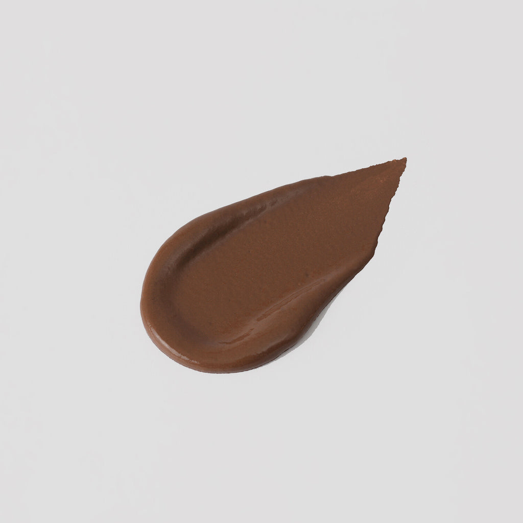 The Overachiever tinted moisturizer and foundation swatch in Spiced Cocoa – vegan, buildable, skin-loving formula by Puzzle Makeup
